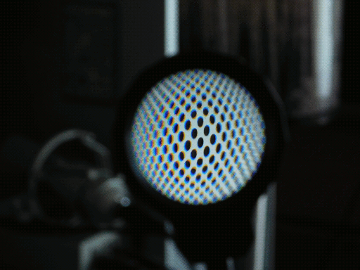 grid pattern of power mac g5 case, as seen through magnifying lens