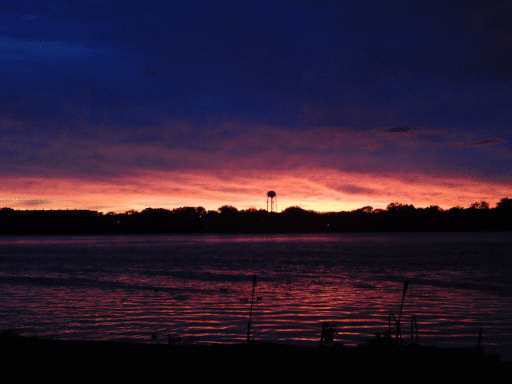 blue and orange sunset-type sky over lake
