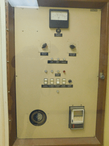 A different climate-control panel behind plastic/glass, also manufactured by Norman Bragar and with similar controls.