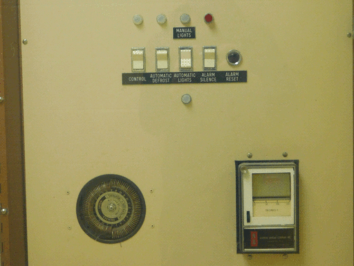 Close up of the bottom half of the second control panel, with exactly the same controls (though in slightly different positions) as the last, though there is no slot to allow access to some of them as on the first.