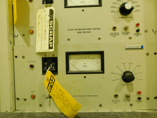 Here we see that bottom module. It's almost identical to the one above it, except the label text is smaller and the RANGE SELECTOR has a different knob. The tag on its power switch is yellow and has HOLD printed on rather than handwritten this time, and also has a date of 5/22/06 in the details. I thought I needed to get pictures of these machines quickly before they got scrapped but apparently they tend to sit around for quite a while...