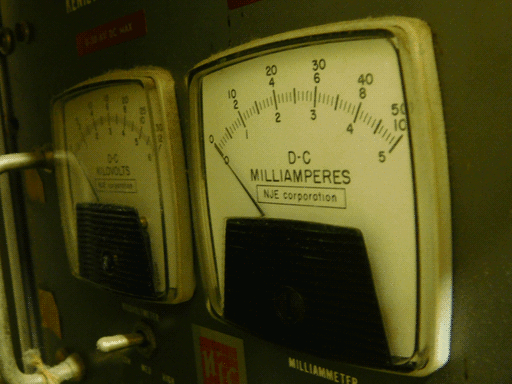 A close-up of the two NJE meters. The kilovoltmeter has three scales- 0-30 and 0-12 on top of the measurement marks, and 0-6 on the bottom. The milliammeter has 0-50 and 0-10 on the top and 0-5 below.